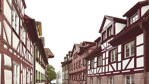 Foto, Gasse mit Fachwerkhäusern.